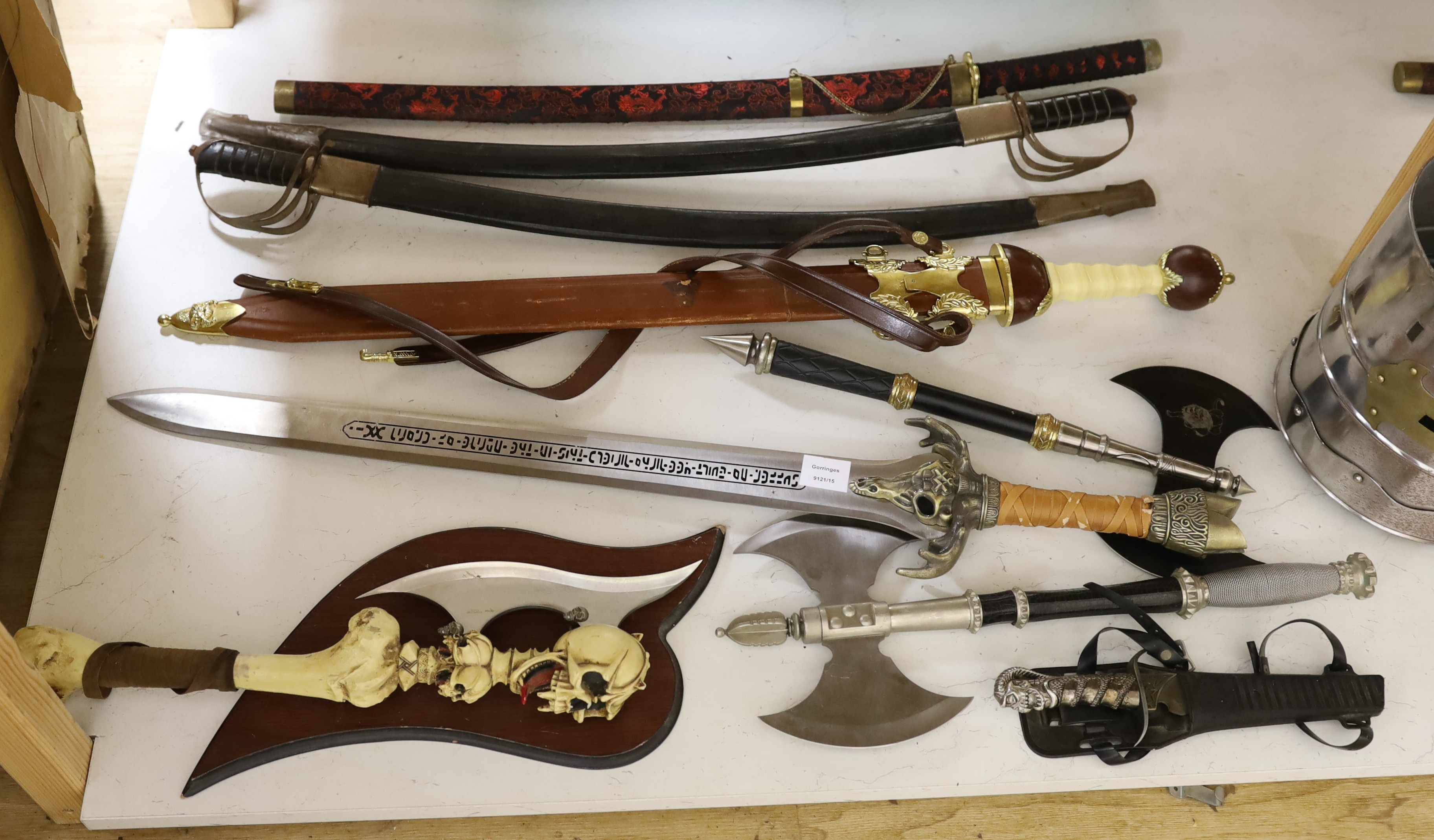 A group of reproduction swords and weapons